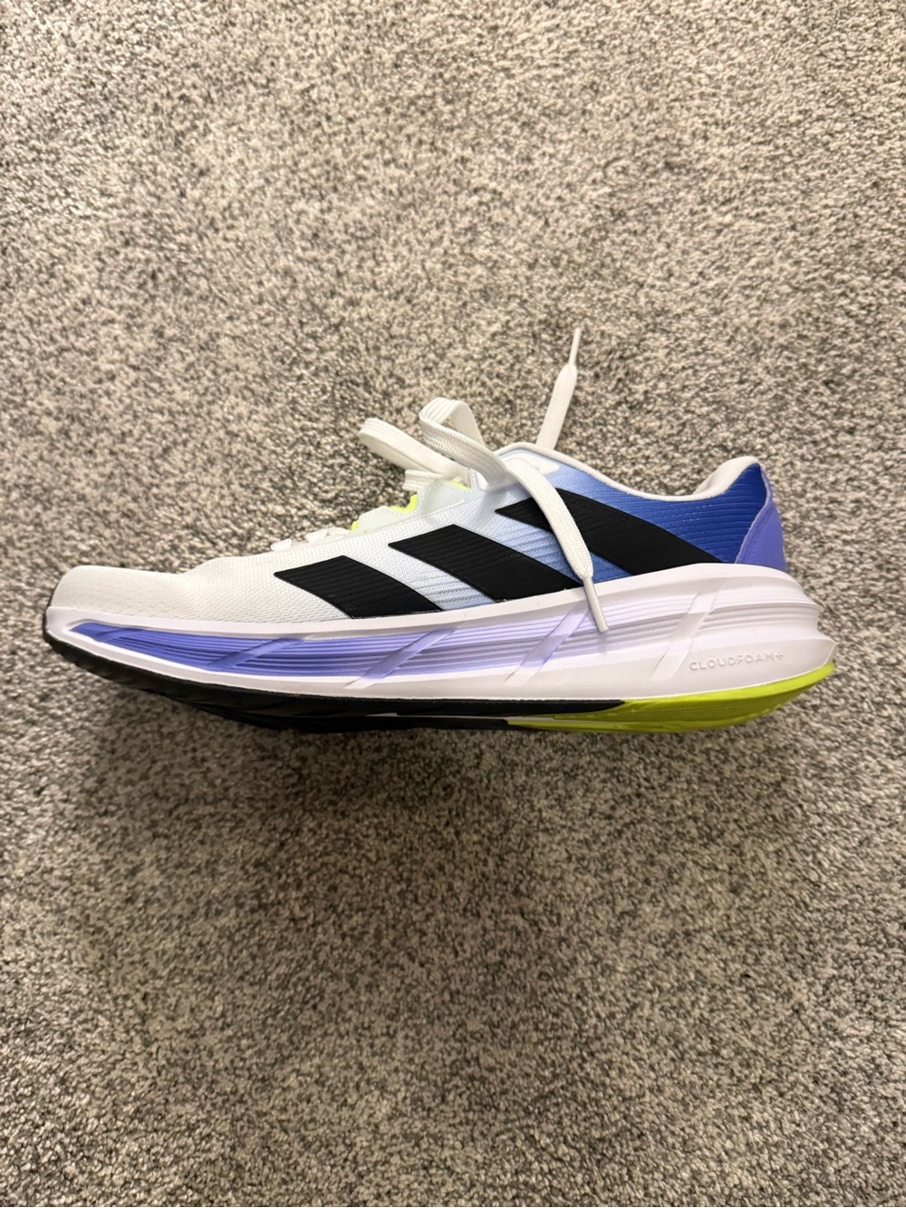 adidas White Running Shoe with Black Stripes and Blue and Yellow Accents